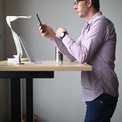 Jake standing at black Kloud desk
