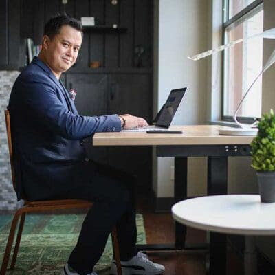 Man Sitting at Kloud Desk